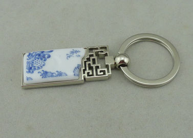 Κράμα ψευδάργυρου 1.5 ίντσας που διαφημίζει Keychains με το κομμάτι πορσελάνης που παρεμβάλλεται
