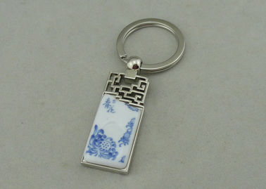 Κράμα ψευδάργυρου 1.5 ίντσας που διαφημίζει Keychains με το κομμάτι πορσελάνης που παρεμβάλλεται